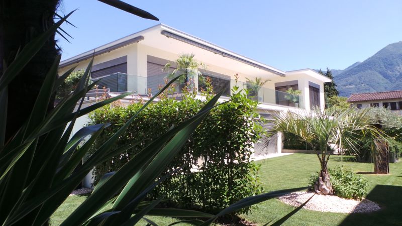 Boardwalk with boats moored on the lake
