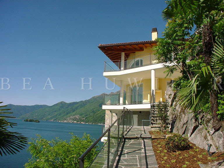 Lake with boats and a distant town